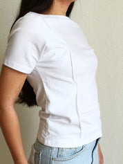 Model wearing a white Wavy Boat Neck Off Shoulder Tee