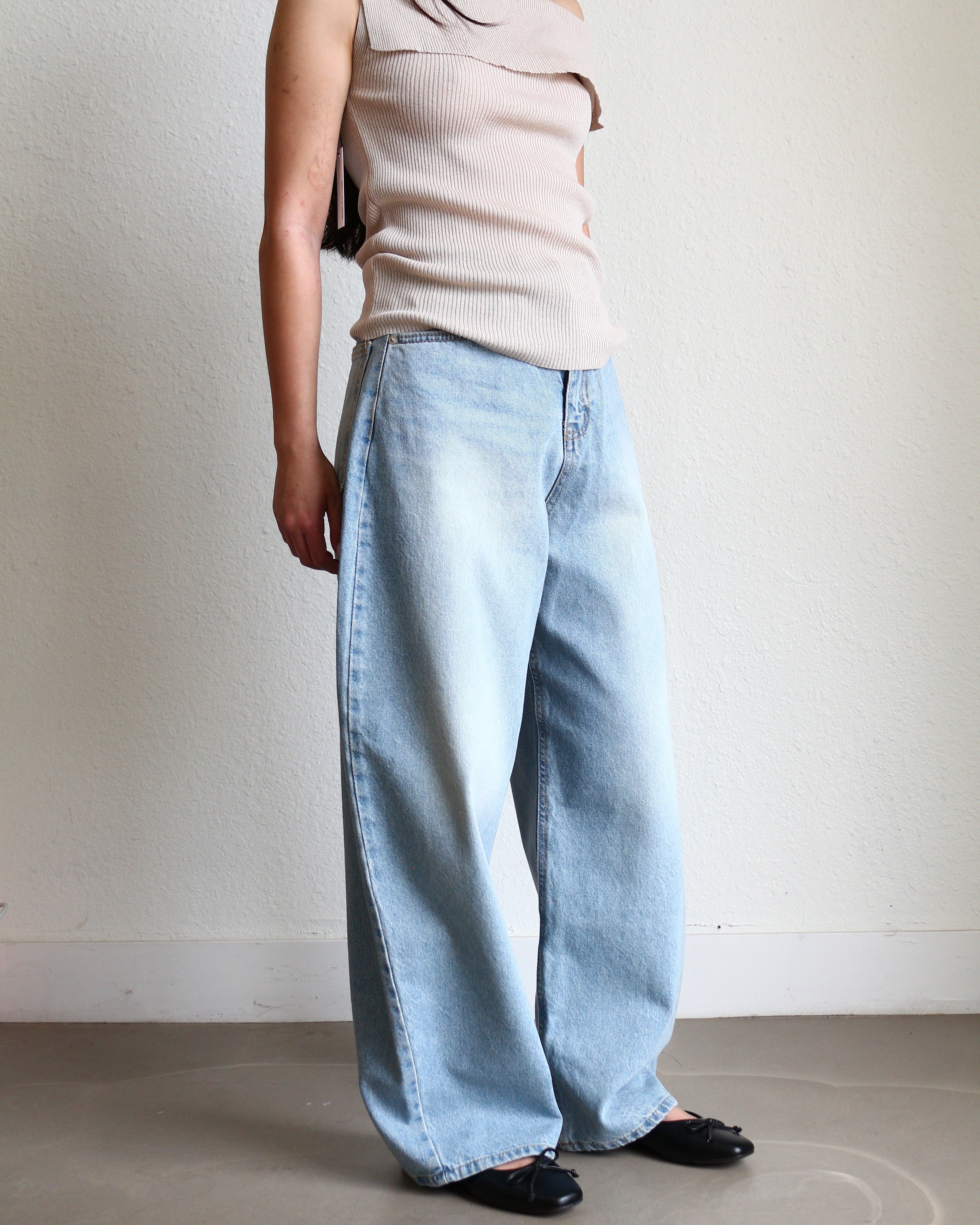 Light blue jeans Wide Barrel Denim - Light Wash wearing black ballet flats and cream ribbed top