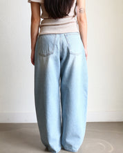 Light blue jeans Wide Barrel Denim - Light Wash wearing black ballet flats and cream ribbed top