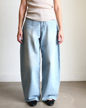 Light blue jeans Wide Barrel Denim - Light Wash wearing black ballet flats and cream ribbed top