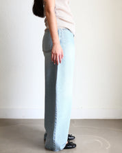 Light blue jeans Wide Barrel Denim - Light Wash wearing black ballet flats and cream ribbed top