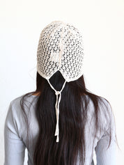Behind Close-up of with a white crochet boho bucket cap
