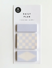 Set of sticky memo pads with geometric patterns on a white background
