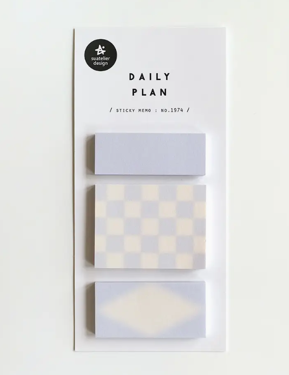 Set of sticky memo pads with geometric patterns on a white background