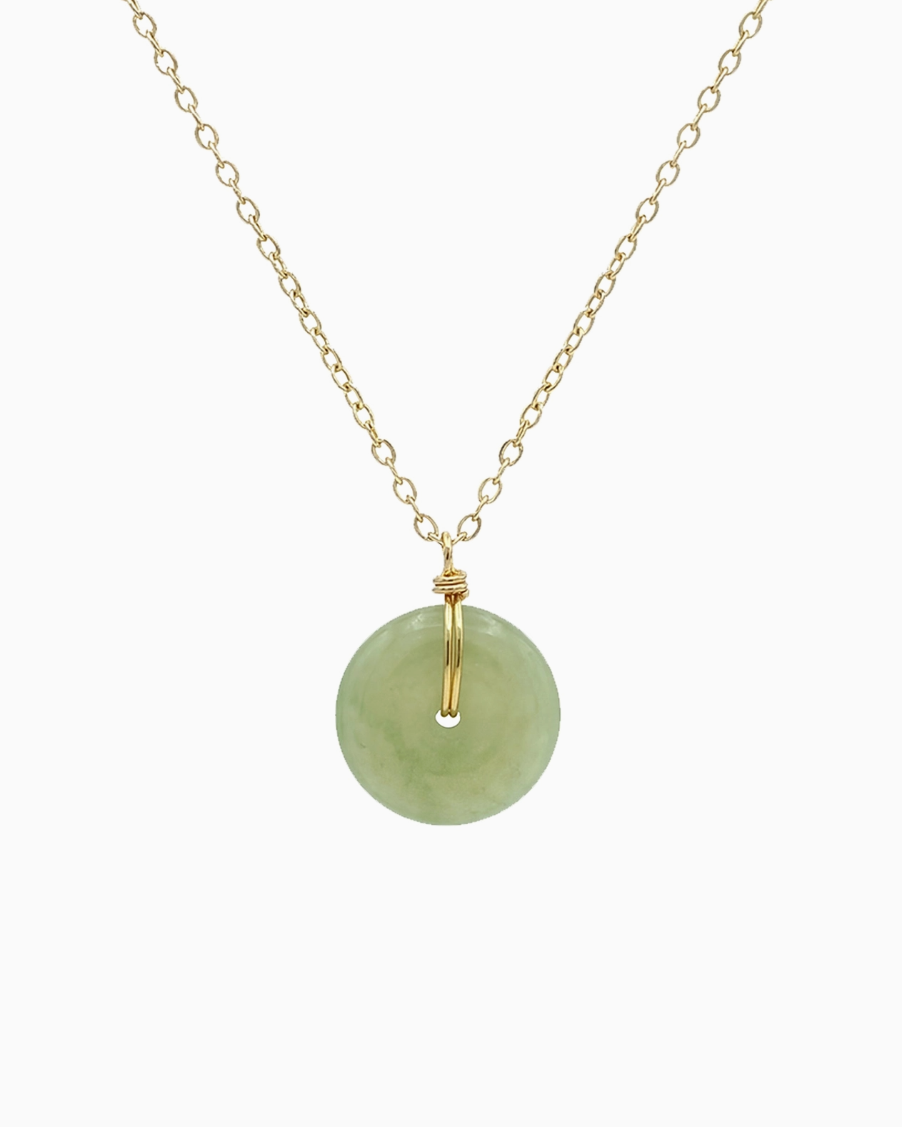 Gold necklace with a round diamond pendant on a white background
