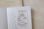 Receipt inside a book with visible text and details.
