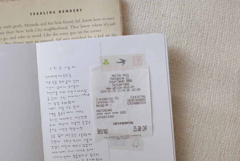 Receipt inside a book with visible text and details.