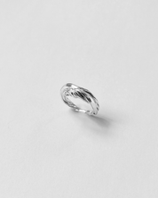 Silver ring on a light gray background