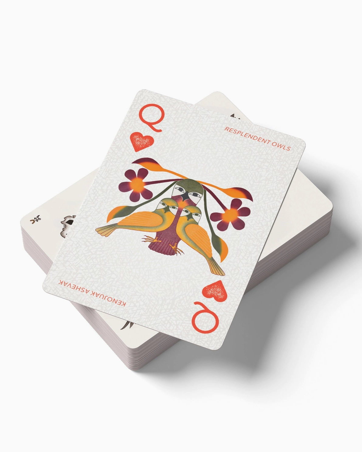 Playing cards with colorful designs on a white background