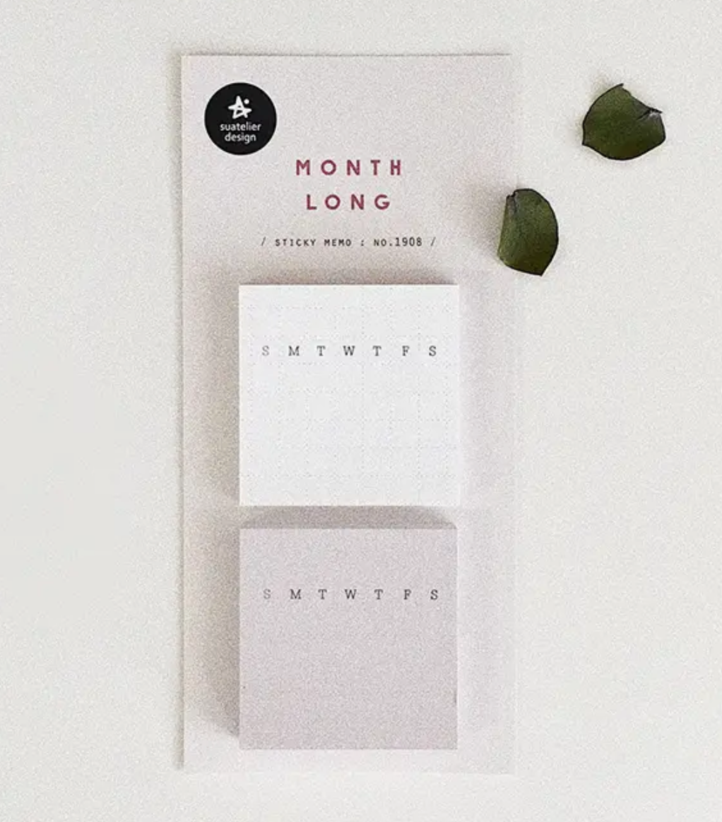 Set of sticky notes with days of the week on a white surface