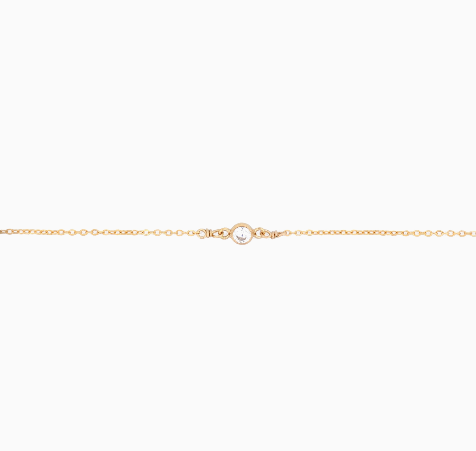 Gold chain bracelet on a white background