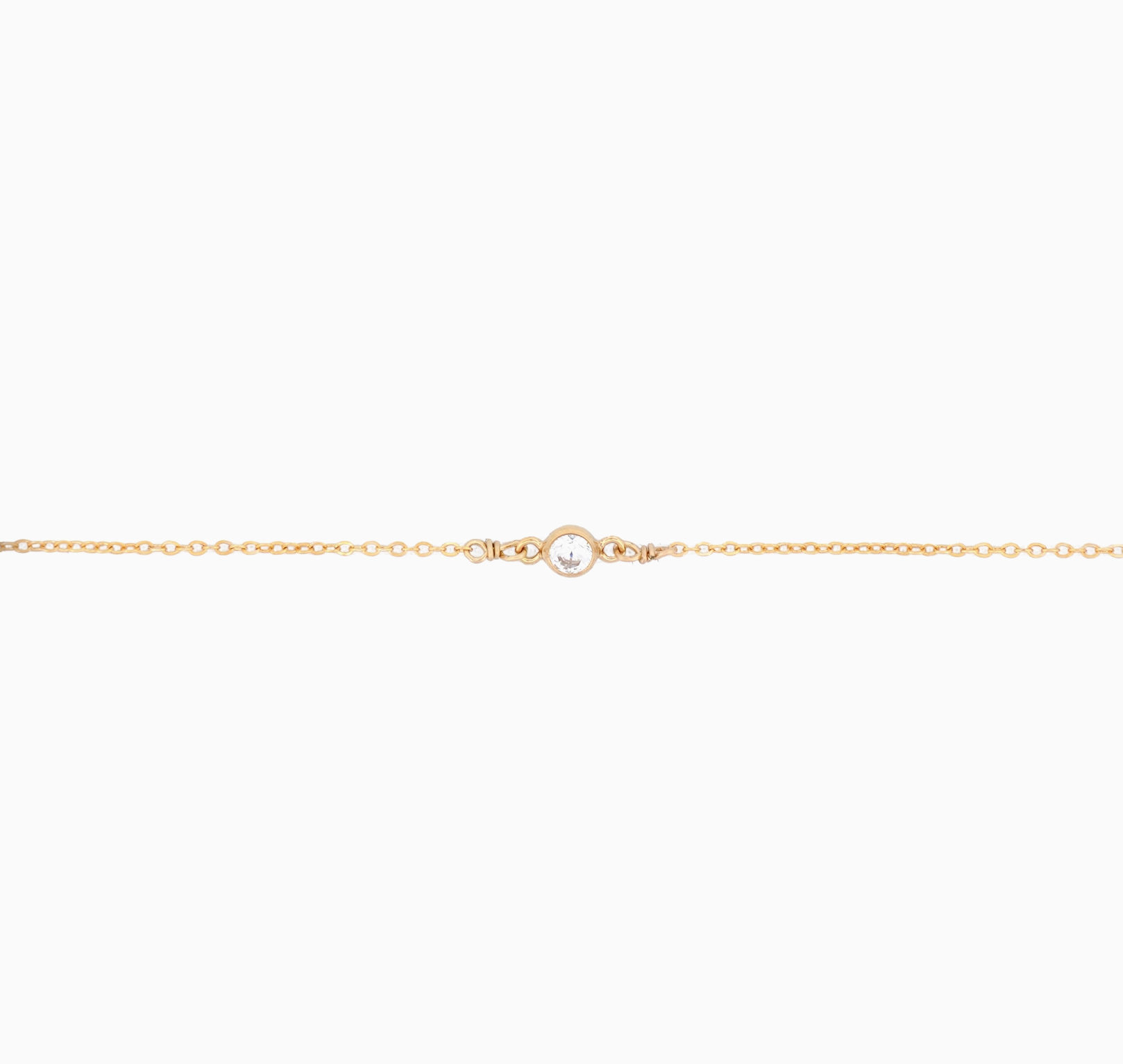 Gold chain bracelet on a white background