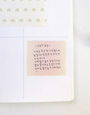 Notebook page with handwritten text on a white background