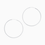 Pair of silver hoop earrings on a white background