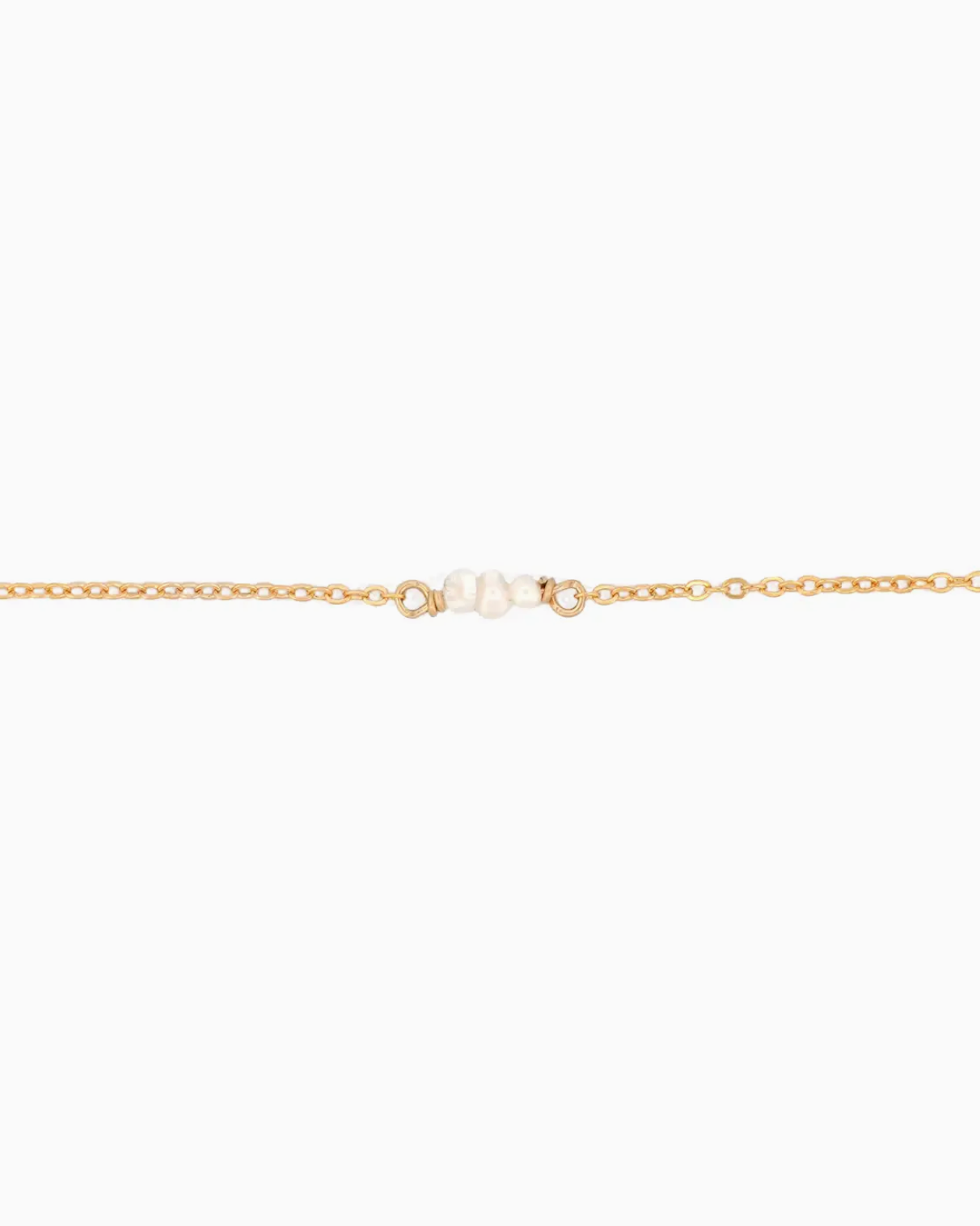 Gold chain necklace on a white background